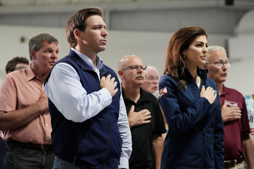 FILE - Republican presidential candidate Florida Gov. Ron DeSantis and his wife Casey stand during the Pledge of Allegiance at a campaign event, Wednesday, May 31, 2023, in Cedar Rapids, Iowa. (AP Photo/Charlie Neibergall, File)