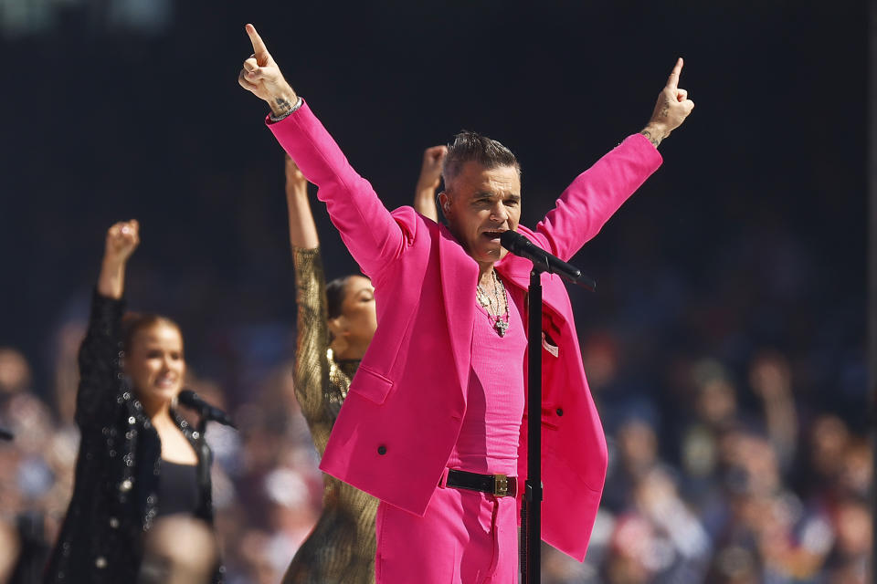 MELBOURNE, AUSTRALIA - SEPTEMBER 24: Robbie Williams performs during the 2022 AFL Grand Final match between the Geelong Cats and the Sydney Swans at the Melbourne Cricket Ground on September 24, 2022 in Melbourne, Australia. (Photo by Daniel Pockett/AFL Photos/via Getty Images)