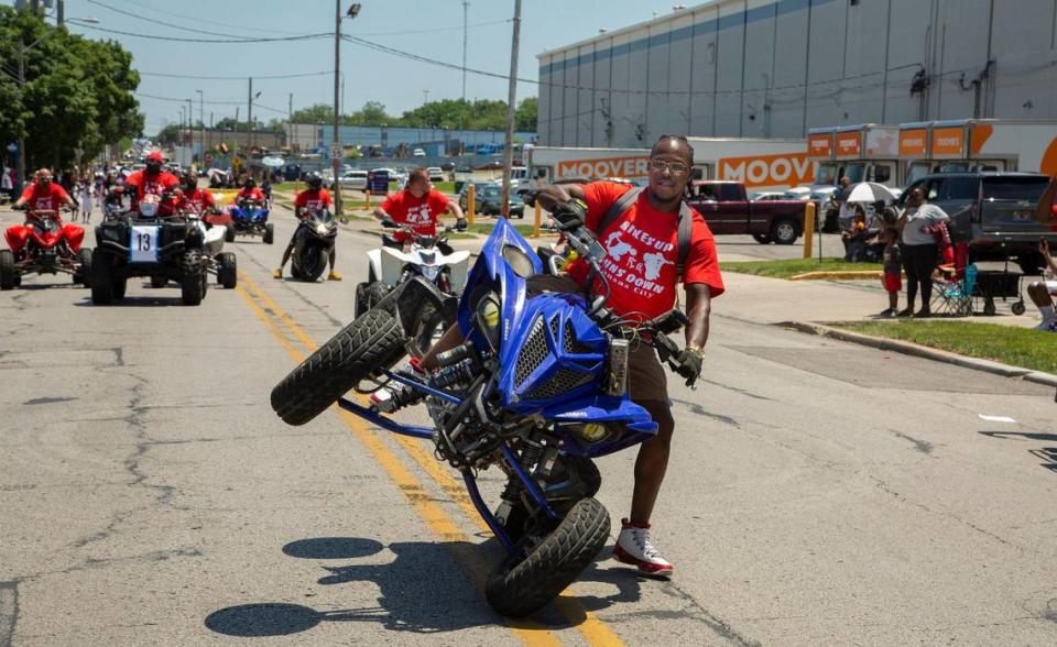 Riders with Bikes Up Guns Down rode past the judges stand at the JuneteenthKC 2021 Cultural Parade Saturday, June 12, 2021 in the Historic Jazz District near 18th and Vine.