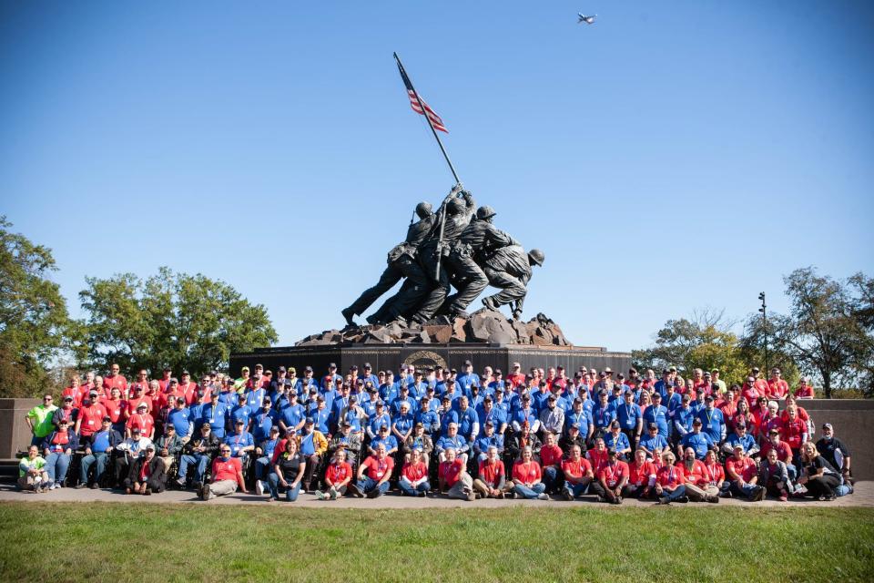 Veterans pose at the Iowa Jima Memorial in Washington, D.C., after being on one of the Lone Eagle flights, which serveveterans who live in areas with no local Honor Flight Network hub.