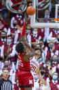 Indiana forward Race Thompson (25) defends as Nebraska center Eduardo Andre (35) takes a shot during the second half of a NCAA college basketball game, Saturday, Dec. 4, 2021, in Bloomington, Ind. (AP Photo/Doug McSchooler)