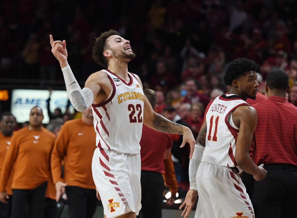 Iowa State's Gabe Kalscheur (22) and guard Tyrese Hunter (11) celebrate after beating Texas 79-70 on Saturday at Hilton Coliseum in Ames.
