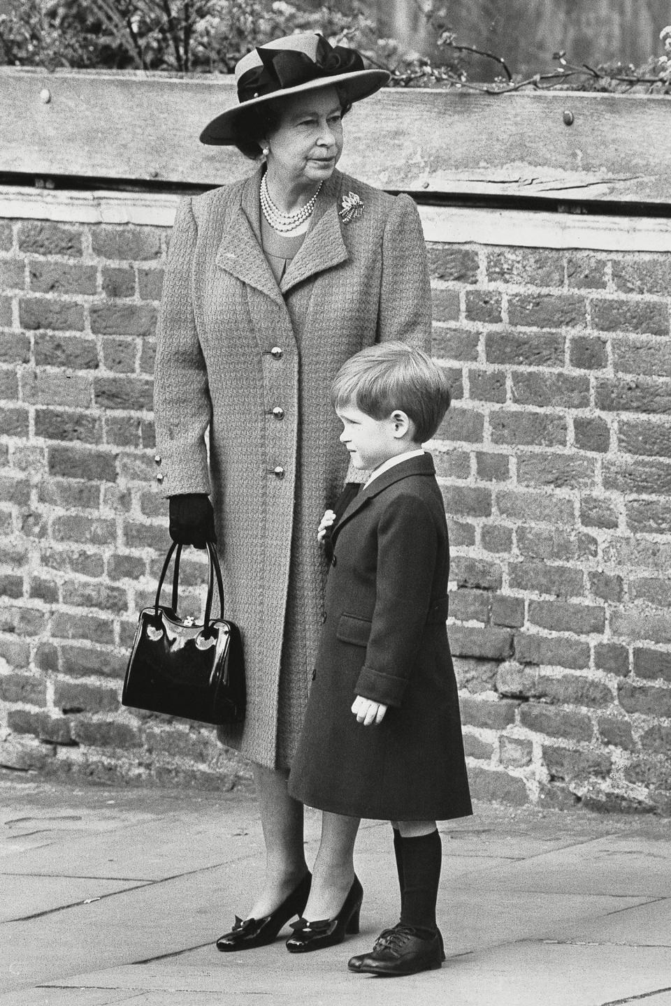 Harry holds onto his grandmother's hand after his <a href="https://people.com/royals/see-every-photo-of-prince-george-and-princess-charlottes-first-official-royal-christmas/" rel="nofollow noopener" target="_blank" data-ylk="slk:first public church outing;elm:context_link;itc:0;sec:content-canvas" class="link ">first public church outing</a> on Easter Sunday 1989. 