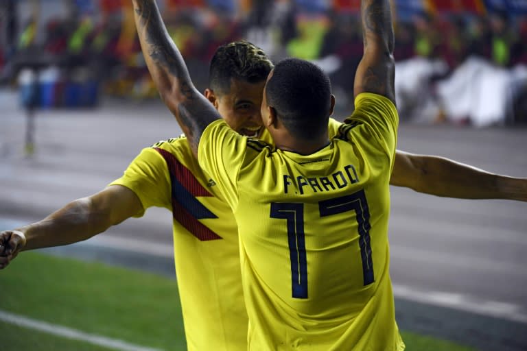 Colombia's Edgar Parado (right) celebrates with Giovanni Moreno after scoring in the 4-0 defeat of China in Chongqing on Tuesday, Marcello Lippi's heaviest loss since taking charge of the national side