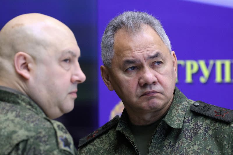 FILE PHOTO: Russian Defence Minister Sergei Shoigu and General Sergei Surovikin visit the Joint Headquarters of the Russian armed forces, in an unknown location