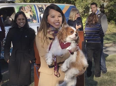 Ebola survivor Nina Pham is reunited with her dog Bentley at the Dallas Animal Services Center in Dallas, November 1, 2014. REUTERS/Lisa Maria Garza