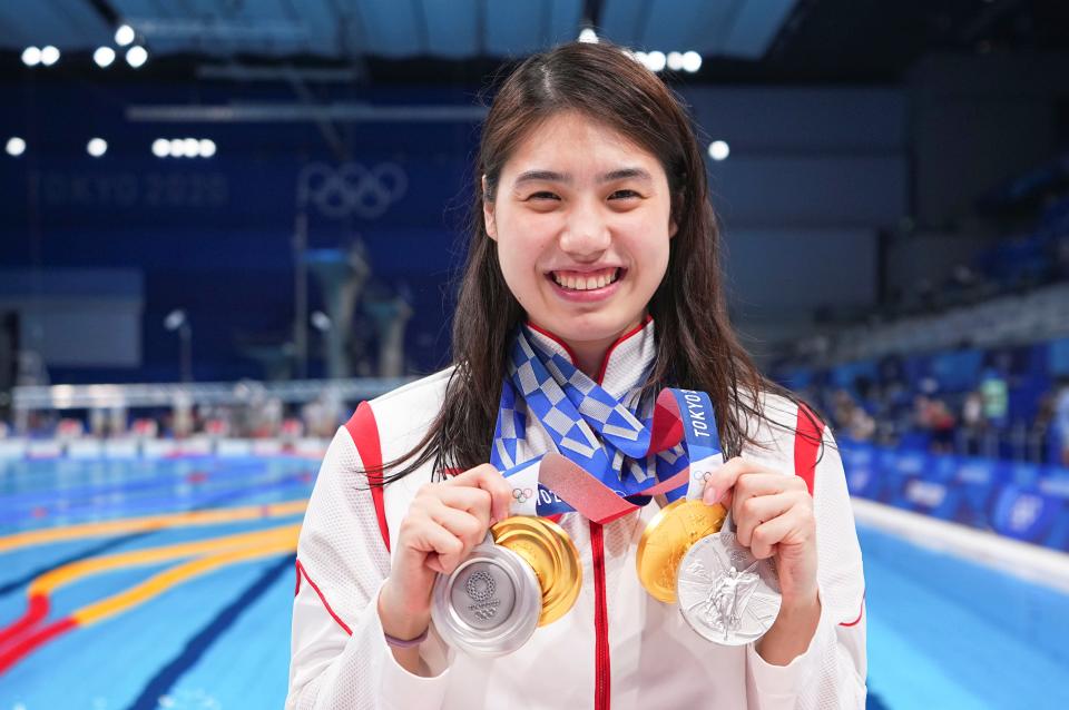 File photo taken on Aug. 1, 2021 Zhang Yufei of China posing for photos with her medals after swimming event atthe Tokyo 2020 Olympic Games in Tokyo, Japan. One of the breakthrough swimming stars at the Tokyo Olympics, Zhang won gold in the women's 200-meter butterfly with a dominating victory and helped China claim the title in the women's 4x200m freestyle relay. She also won silver in the 100m butterfly and mixed 4x100m medley relay in Tokyo. (Photo by Xu Chang/Xinhua via Getty Images)