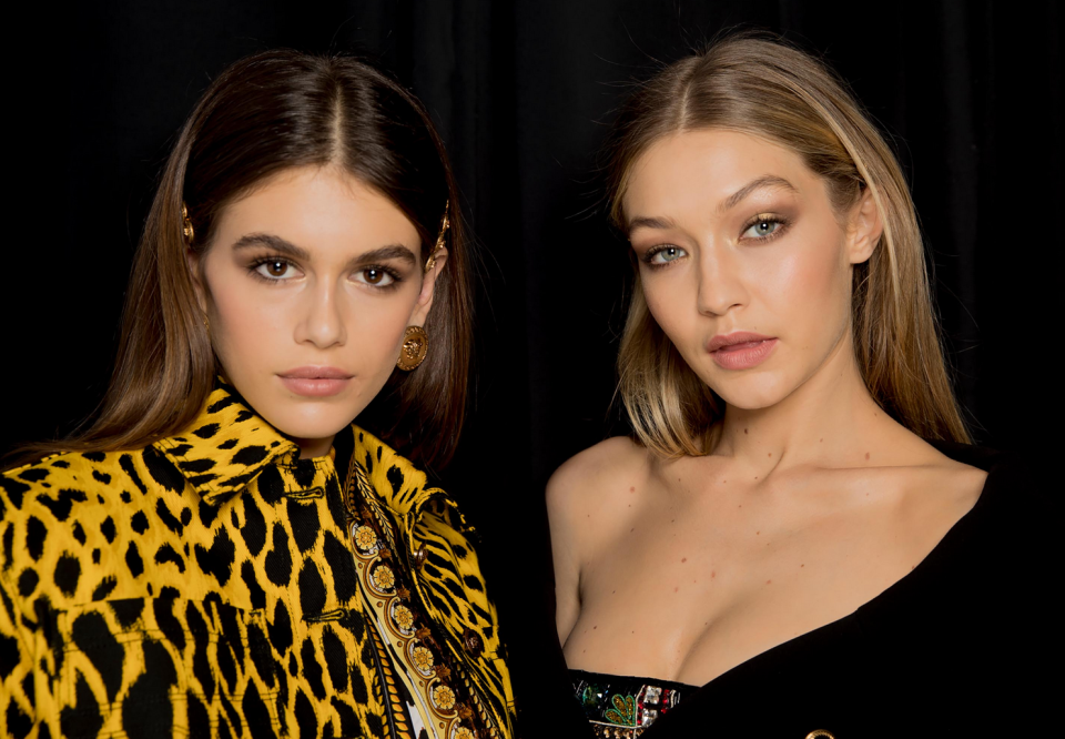 <p>Models of the moment Gigi and Kaia show off their flawless complexions.<em> [Photo: Versace]</em> </p>