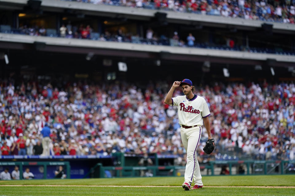 Philadelphia Phillies pitcher Aaron Nola tips his hat after being pulled in eighth inning of a baseball game against the New York Yankees, Sunday, June 13, 2021, in Philadelphia. (AP Photo/Matt Slocum)