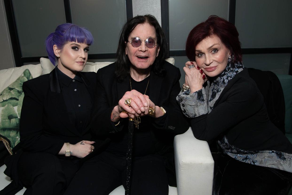 Kelly Osbourne and her parents, musician Ozzy Osbourne and TV personality Sharon Osbourne, in 2019. (Photo: Emma McIntyre via Getty Images)