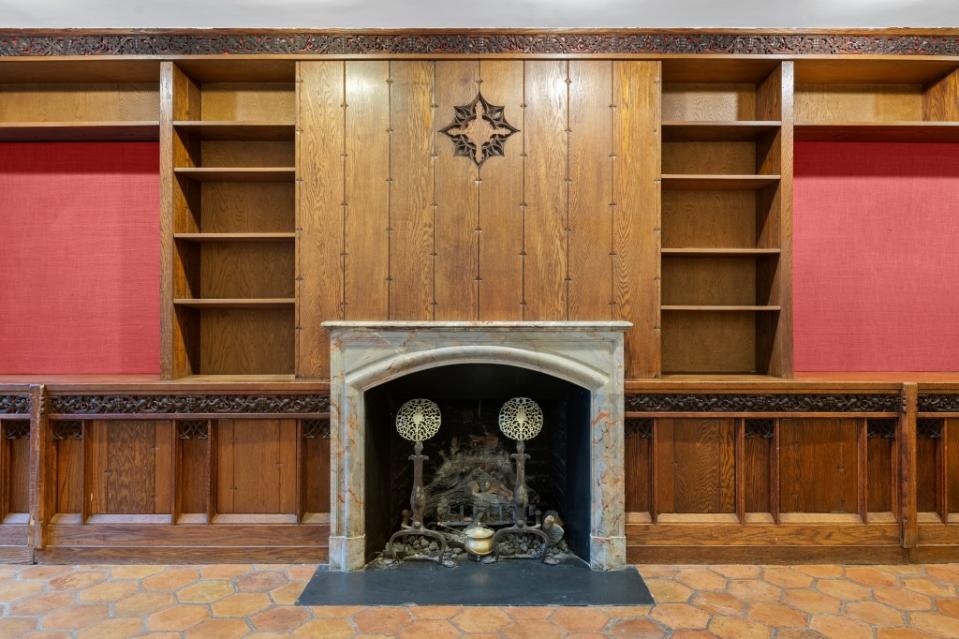 The historic brownstone was built in 1872 and still has original details like this mantel. Michael Finkelstein