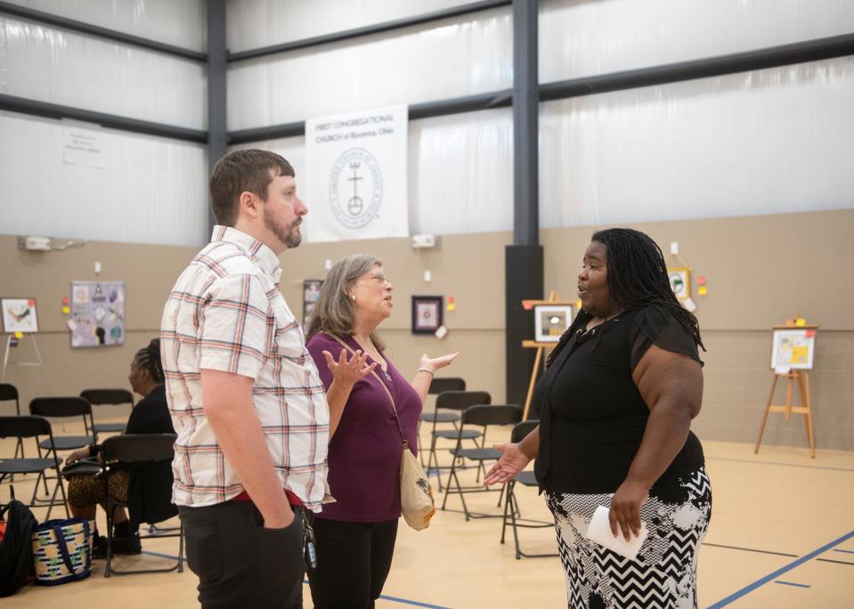 King Kennedy Community Center multi-use recreational facility open house on Thursday, September 8. KKCC program manager, Myia Sanders, talks with Ellen Jacobs and her son, Tim Jacobs.