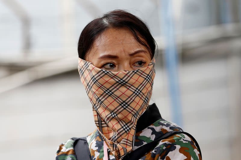 A woman wears a handkerchief at station Tanah Abang, following the outbreak of the coronavirus in China, in Jakarta