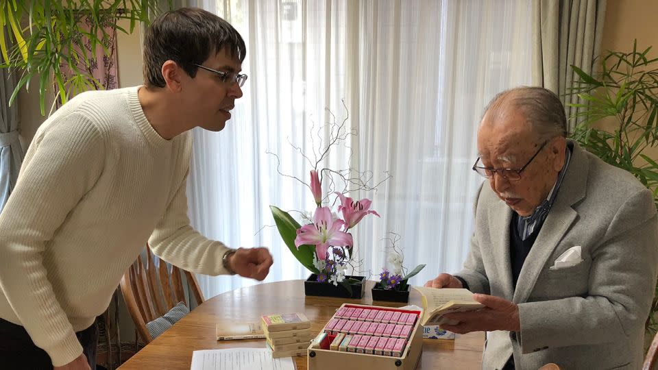 Shigeichi Negishi, then 95, shows author Matt Alt his invention in 2018. - Courtesy Hiroko Yoda