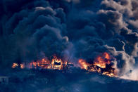 <p>A house engulfed in flames as the Creek Fire burns in Los Angeles, California on Dec. 5, 2017. The raging fire fueled by strong Santa Ana winds has burned more than 11,000 acres and caused the evacuation of 115,000 residents. (Photo: Ronen Tivony/NurPhoto via Getty Images) </p>