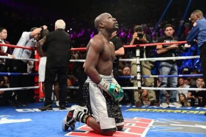 Floyd Mayweather kneels after the final round against Andre Berto (not pictured) in their WBA/WBC welterweight title bout at MGM Grand Garden. Mayweather won via unanimous decision. (Joe Camporeale/USA TODAY Sports)