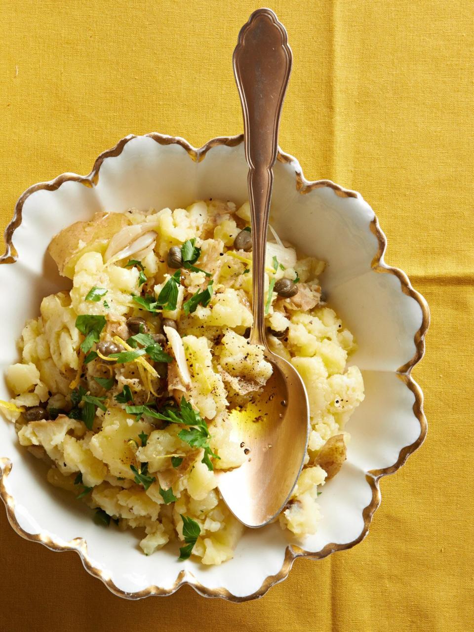 These creamy mashed potatoes are so tasty, they might just steal the show from the entree! Salty capers, garlic, lemon, and parsley infuse each bite of potatoes with flavor.