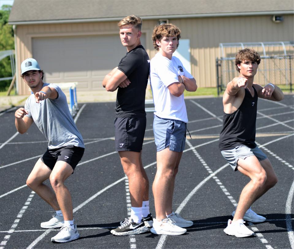 Cambridge boys 4x200 relay team of Owen Feldner, left, Xander Caldwell, Eli Edwards, center and Reed Johnson, right, ham it up before practice Wednesday night in preparation for this weekend's OHSAA State Track and Field Championships in Columbus.