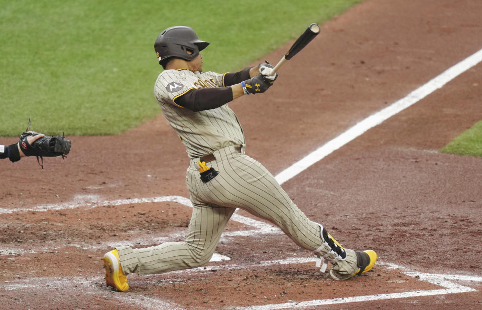 San Diego Padres' Juan Soto hits an RBI double against the Toronto Blue Jays during the third inning of a baseball game Tuesday, July 18, 2023, in Toronto. (Chris Young/The Canadian Press via AP)