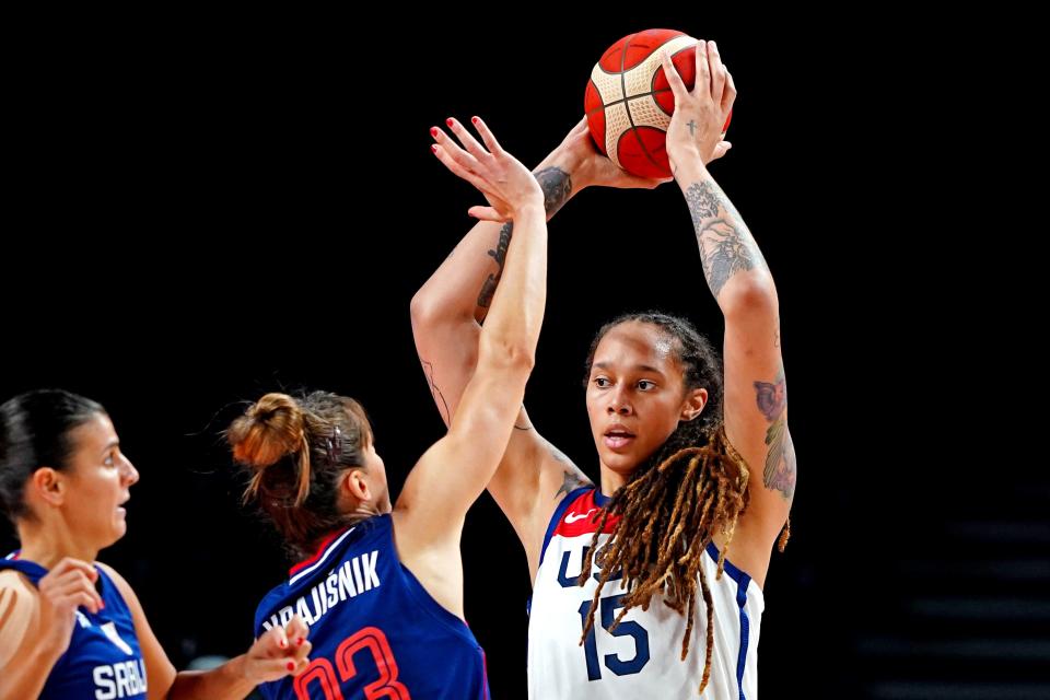 Brittney Griner (15) handles the ball against Serbia center Tina Krajisnik (33) in the women's basketball semifinal during the Tokyo 2020 Olympics at Saitama Super Arena.