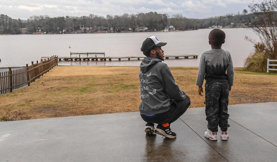 Jamieryon Yeargin, left, of Belton talks with his little brother Isaiah Yeargin after the Anderson Watershed Protection Grant awards at McFalls Landing near Broadway Lake in Anderson, S.C. Thursday, January 12, 2023.  The County Watershed Protection Council announced grants from $30,000 to $90,000 to both Rocky River Conservancy, and the Anderson Soil and Water Conservation District, money from a 2014 Clean Water Lawsuit which the U.S. Supreme Court awarded $1.5 million to Anderson County toward improving water in the county. Yeargin and his father Larandas Yeargin of Heavenly Hands of Belton, came because they were interested in helping keep their water clean.