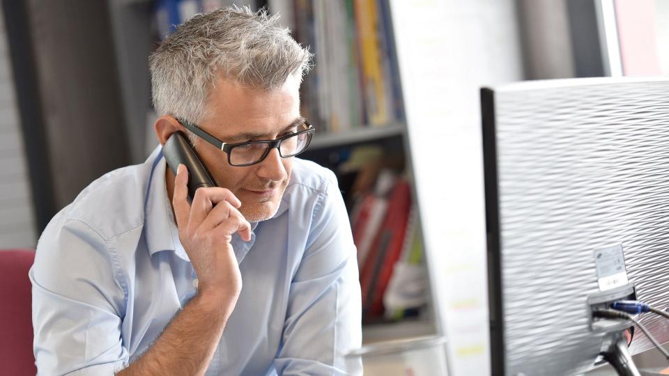 Businessman in office talking on phone