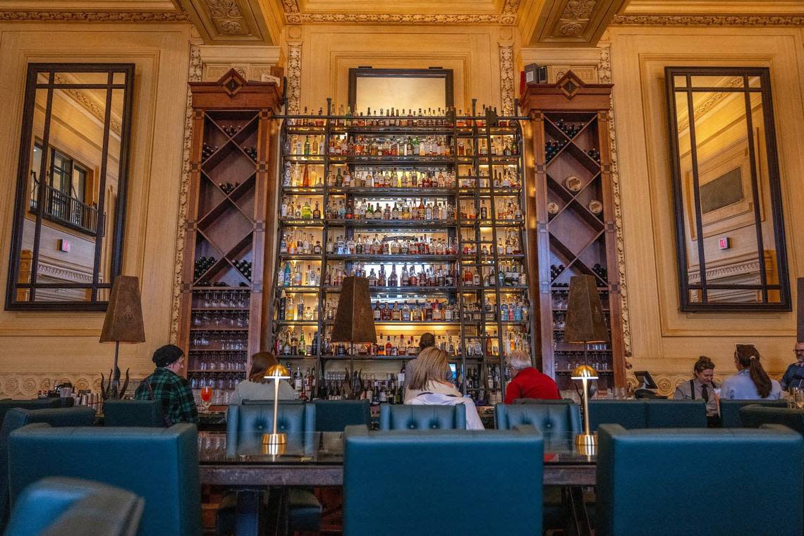 Nine shelves of liquor tower above the bar at Pierpont’s in Union Station.