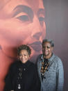 In this photo provided by Brad Fay, Beverly Mills, 71, left, of Pennington, N.J., and Elaine Buck, 67, of Hopewell Borough, N.J., stand in front of a mural in Princeton, N.J., on Jan. 19, 2019. The two have traced Black history in their local communities back the Revolutionary War and have founded a Black history museum nearby. They speak regularly on local Black history to schoolchildren and adult gatherings. (Brad Fay via AP)