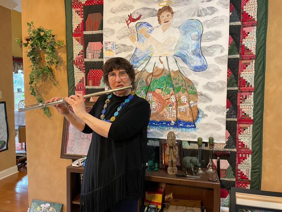 Children’s book author Becky Chaffee takes her own advice to heart practicing her flute playing, Wednesday, Jan. 19, 2022.