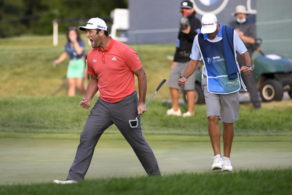 The few people in the gallery who saw Rahm's putt live were wearing masks. (Photo by Tracy Wilcox/PGA TOUR via Getty Images)