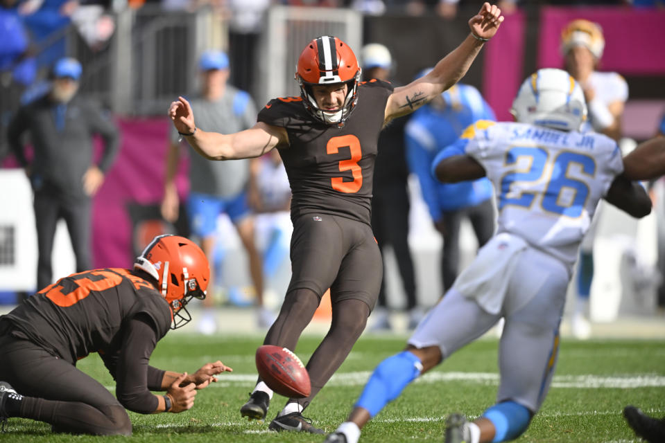 Cleveland Browns place kicker Cade York (3) tries for a field goal from the hold of Corey Bojorquez as Los Angeles Chargers cornerback Asante Samuel Jr. (26) pressures with less than 20 seconds left during the second half of an NFL football game, Sunday, Oct. 9, 2022, in Cleveland. York missed the attempt and the Browns lost 30-28. (AP Photo/David Richard)