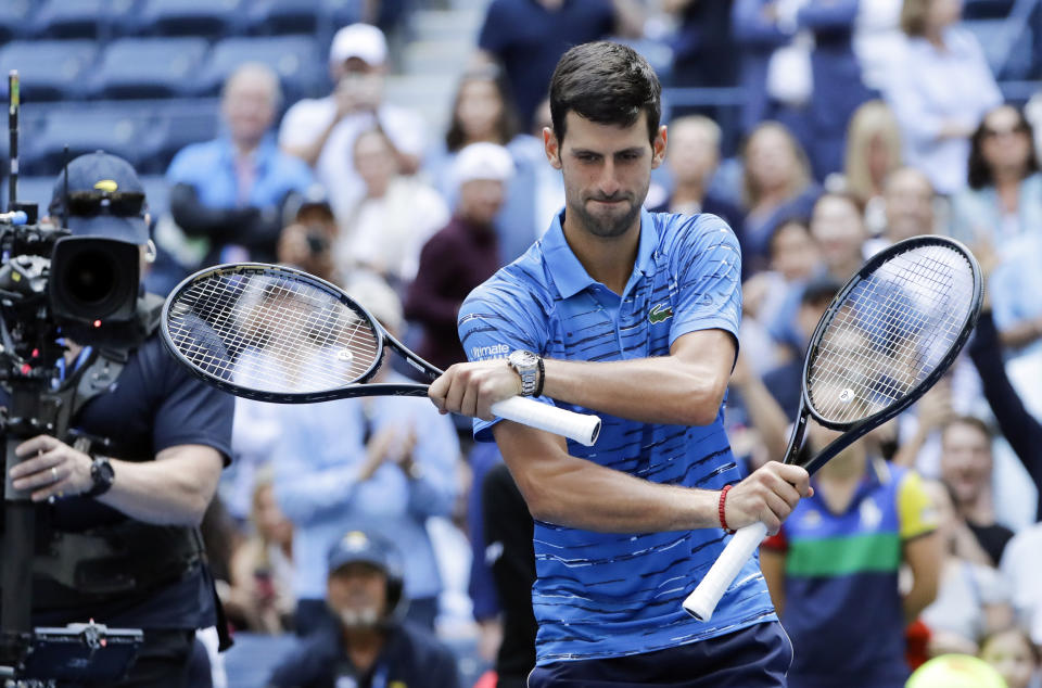 Novak Djokovic, of Serbia, dances for fans after beating Roberto Carballes Baena, of Spain, during the first round of the US Open tennis tournament Monday, Aug. 26, 2019, in New York. (AP Photo/Frank Franklin II)