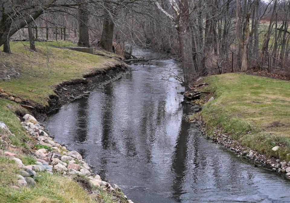 Prairie River flows through backyards in Bronson Township.