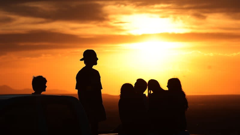 Teenagers watch the sunset from their pickup truck in Holladay on Thursday, June 13, 2024.  Utah is leading the nation with it’s  economic strength, charitable giving, religiosity and limited alcohol consumption.