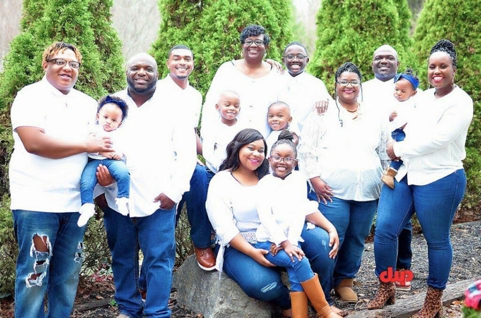 Secoya Williams, front center, is pictured with her family.