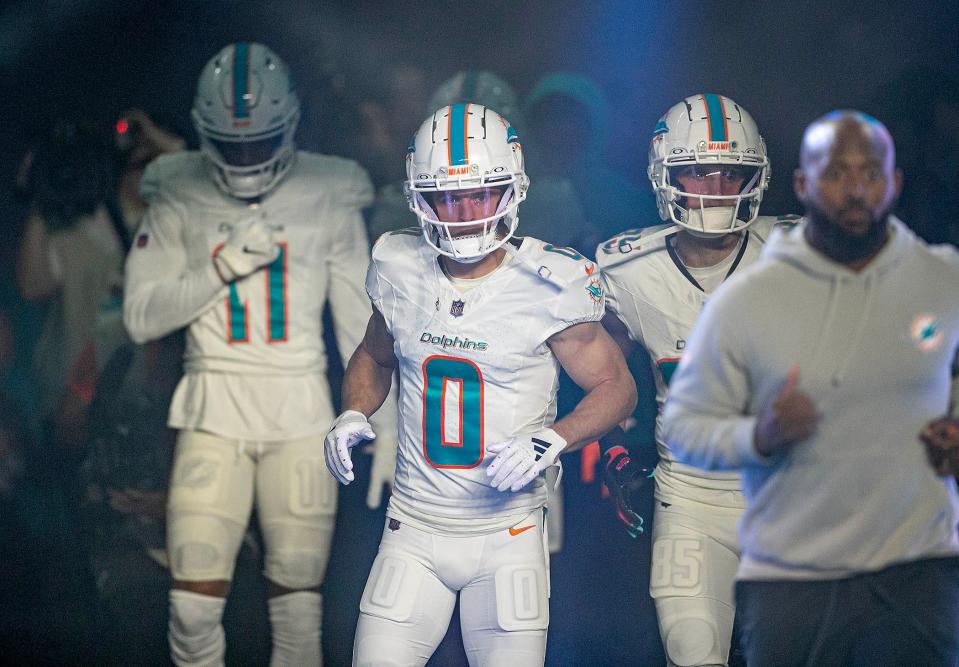 Miami Dolphins receiver Braxton Berrios, leads his teammates entering the field just before the start of their game agains the Buffalo Bills NFL football game Jan 07, 2024, in Miami Gardens.