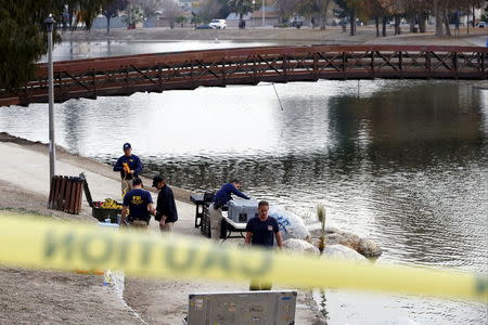 FBI agents pack up diving gear after searching in the water at Seccombe Lake Park, after last week's shooting in San Bernardino, California, December 10, 2015. REUTERS/Patrick T. Fallon