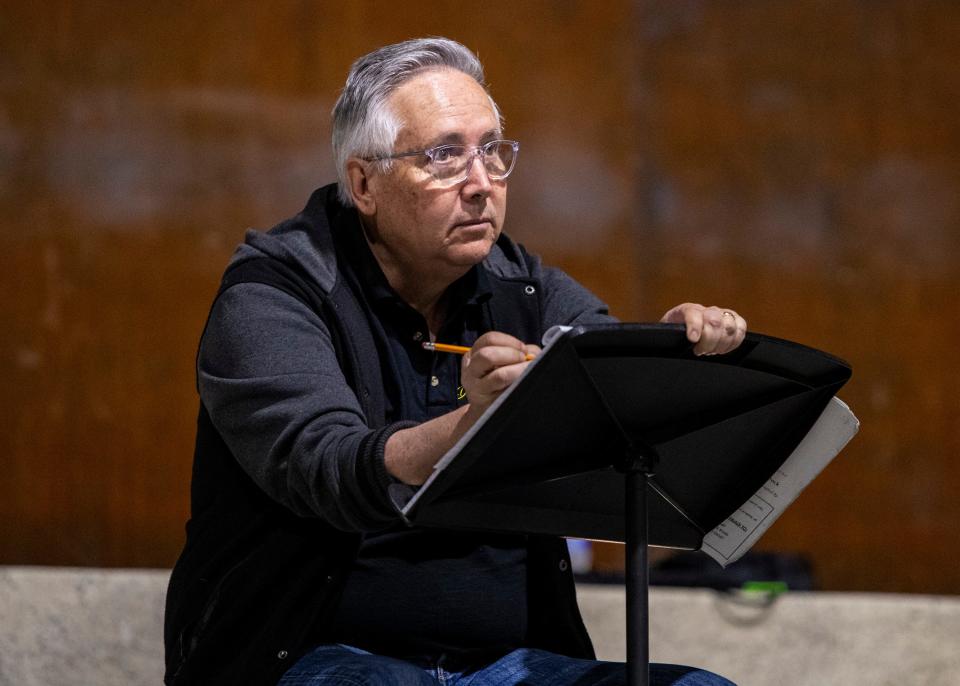 Director Ray Limon jots down notice for his cast during a rehearsal for "Fiddler On The Roof" at the Rancho Mirage Amphitheater in Rancho Mirage, Calif., Tuesday, Feb. 27, 2024.