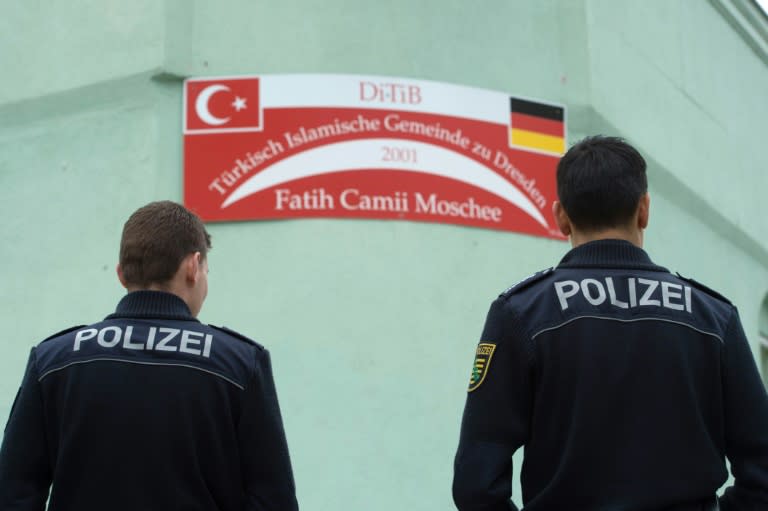 Police stand in front of the Fatih Camii Mosque in Dresden, eastern Germany, on September 27, 2016 after a bomb attack