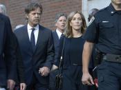 Felicity Huffman leaves federal court with her husband William H. Macy, left, and her brother Moore Huffman Jr. rear center, after she was sentenced in a nationwide college admissions bribery scandal, Friday, Sept. 13, 2019, in Boston. (AP Photo/Michael Dwyer)