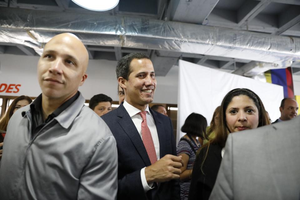 Venezuela's opposition leader and self-proclaimed interim President Juan Guaido smiles at the end of a press conference in Caracas, Venezuela, Monday, June 17, 2019. (AP Photo/Ariana Cubillos)