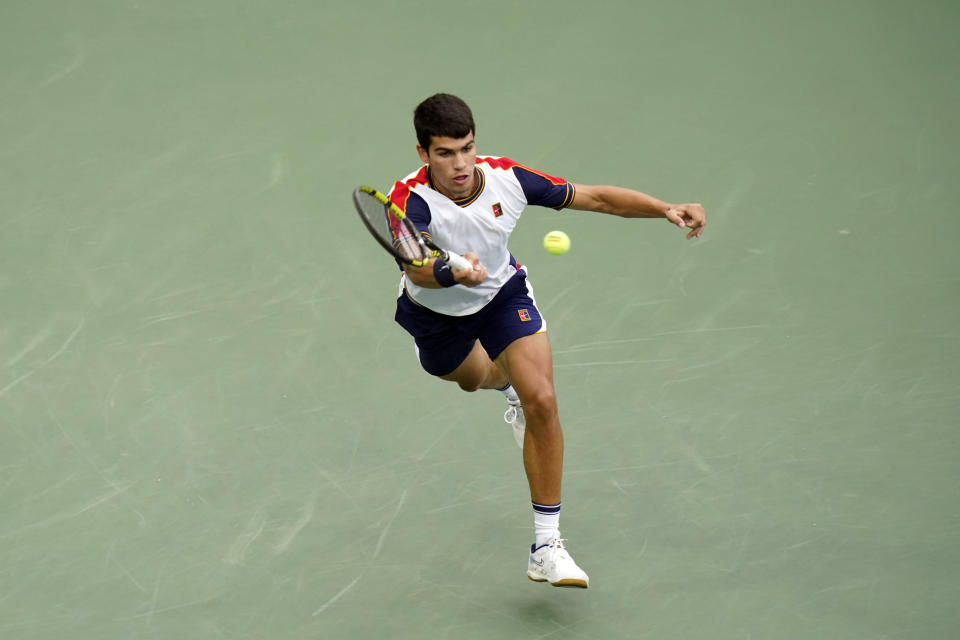 Carlos Alcaraz, of Spain, returns against Peter Gojowczyk, of Germany, during the fourth round of the U.S. Open tennis championships, Sunday, Sept. 5, 2021, in New York. (AP Photo/Frank Franklin II)