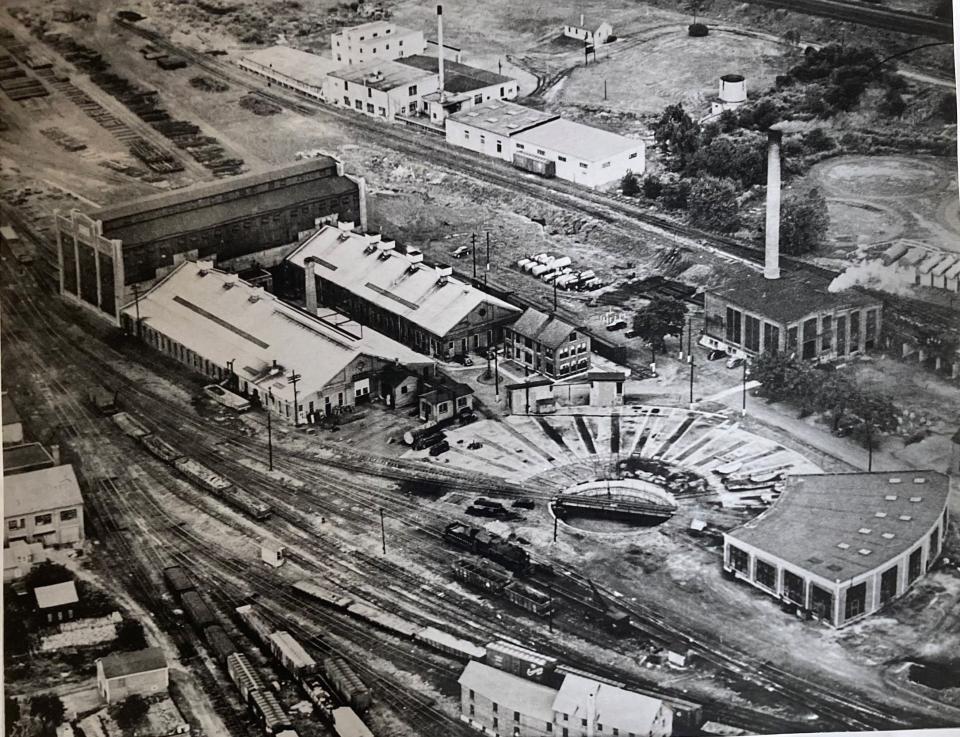 This photo shows what the roundhouse where Jim's Farmers Market is located used to look like. The building on the right of the photo is where the farmers market is located. The rounded section on the right today faces Grant Street.