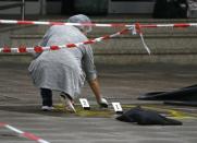 A police investigator works at the crime scene after a knife attack in a supermarket in Hamburg, Germany, July 28, 2017. REUTERS/Morris Mac Matzen