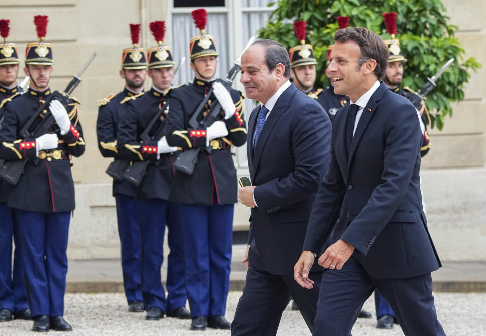 Egyptian President Abdel Fattah el-Sissi, left, is welcomed by French President Emmanuel Macron at the Elysee Palace, Friday, July 22, 2022. (AP Photo/Michel Euler)