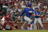 Chicago Cubs' Ian Happ hits an RBI double during the fifth inning of a baseball game against the St. Louis Cardinals Friday, June 24, 2022, in St. Louis. (AP Photo/Jeff Roberson)