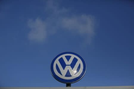 A Volkwagen compnay logo sits atop the VW factory in Wolfsburg, Germany November 20, 2015. REUTERS/Ina Fassbender