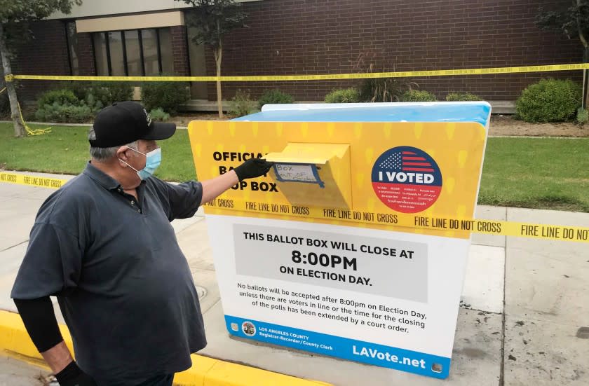 BALDWIN PARK CA OCTOBER 19, 2020 - Baldwin Park resident John Rios, who dropped off his ballot off an official ballot box at the Baldwin Park library a couple weeks ago, stopped by to view the voting box that caught fire Sunday night. Rios is wondering if officials are going to notify those who's ballots were burned. (Allen J. Schaben / Los Angeles Times)