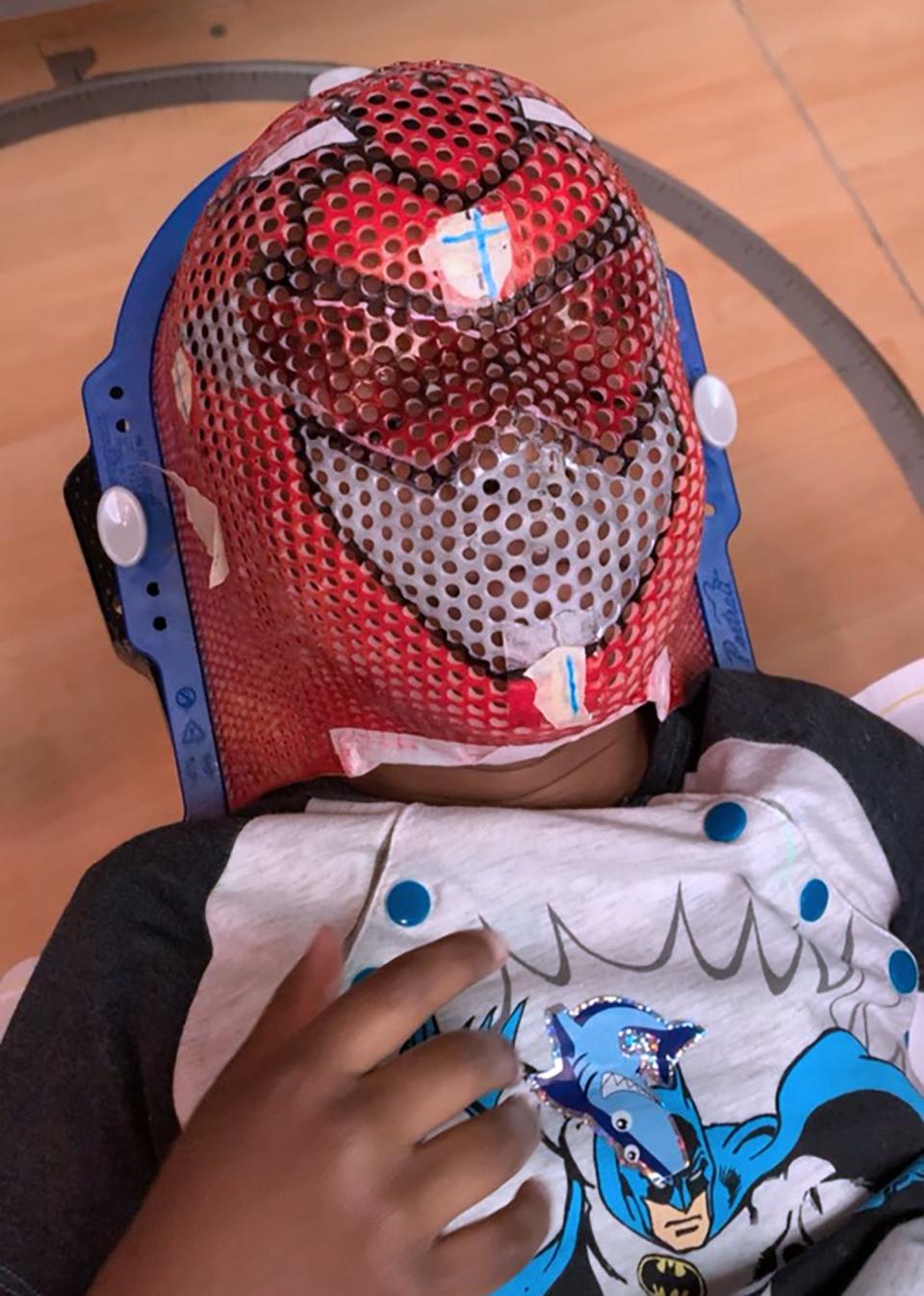 Caidence Carnes wore a Power Ranger mask created by radiation therapist Courtney Shanmugabaskaran while he was receiving treatment in 2019 for anaplastic ependymoma. The personalized decorations are meant to help kids feel more at ease and in control.