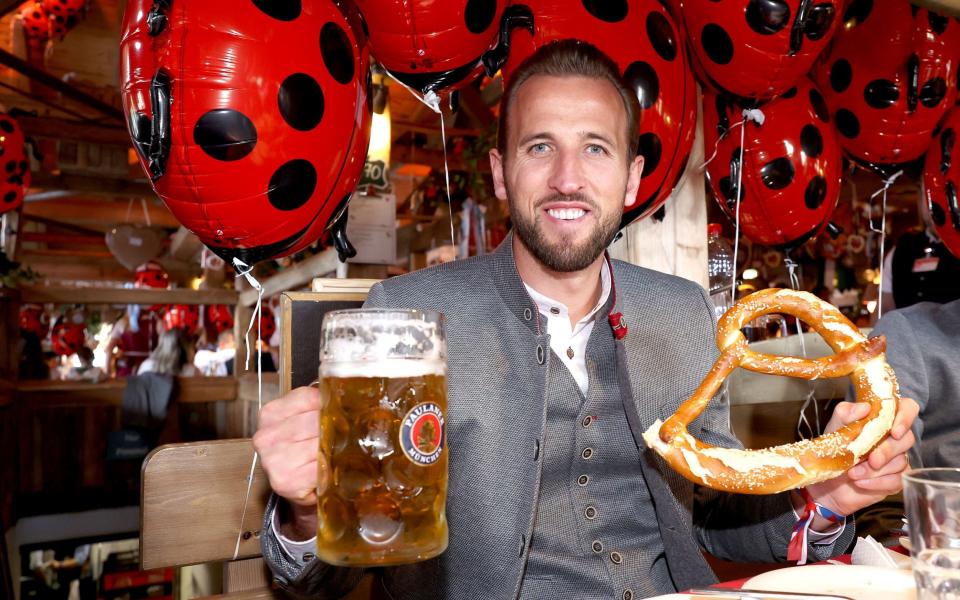 Harry Kane with beer and giant pretzel at Oktoberfest